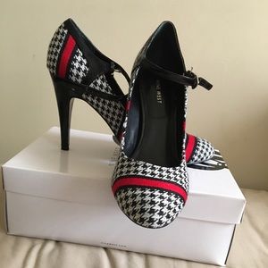 Black, white, and red pumps